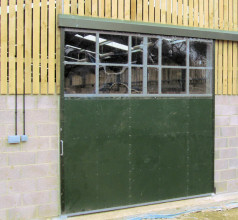 Sliding doors for steel framed farm buildings.