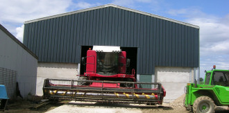 Steel framed grain store with concrete wall panels and floor.