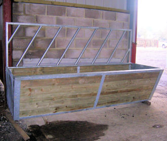 Galvanised steel cattle feed trough / barrier.