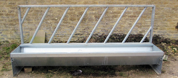 Galvanized steel cattle feed troughs / barriers.